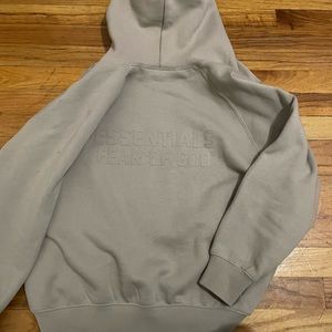 fear of god essential zip up hoodie